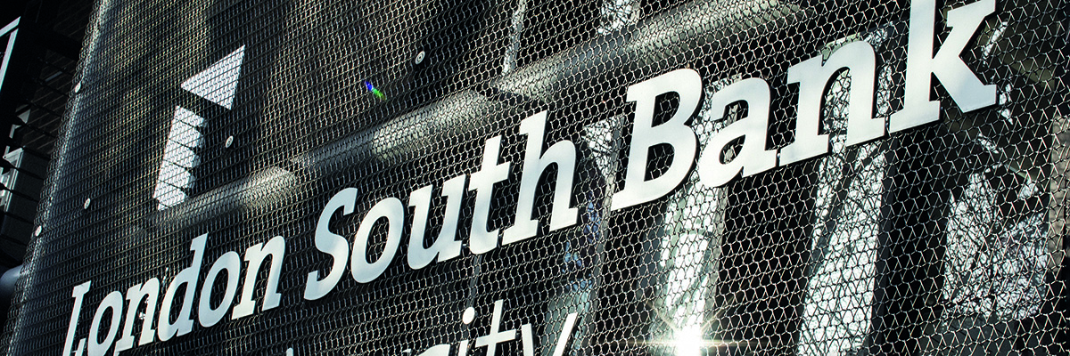 A building sign with the words 'London South Bank University' on a metal grill